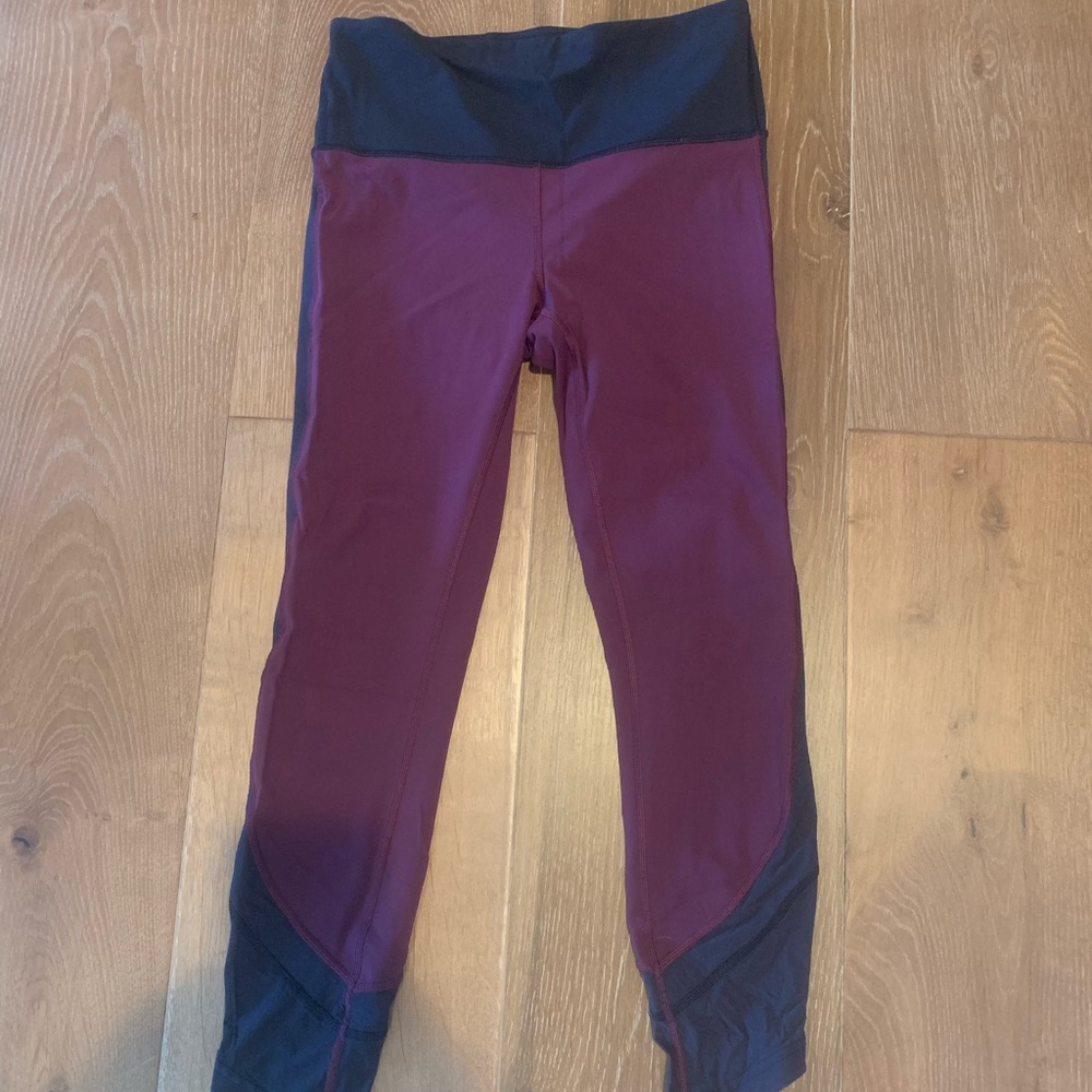 Maroon and black lululemon leggings (cropped)